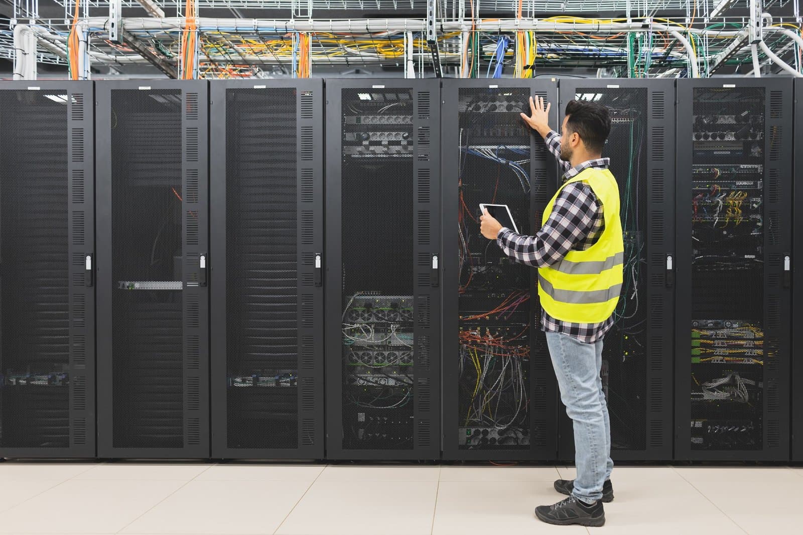 engineer-inspecting-server-racks