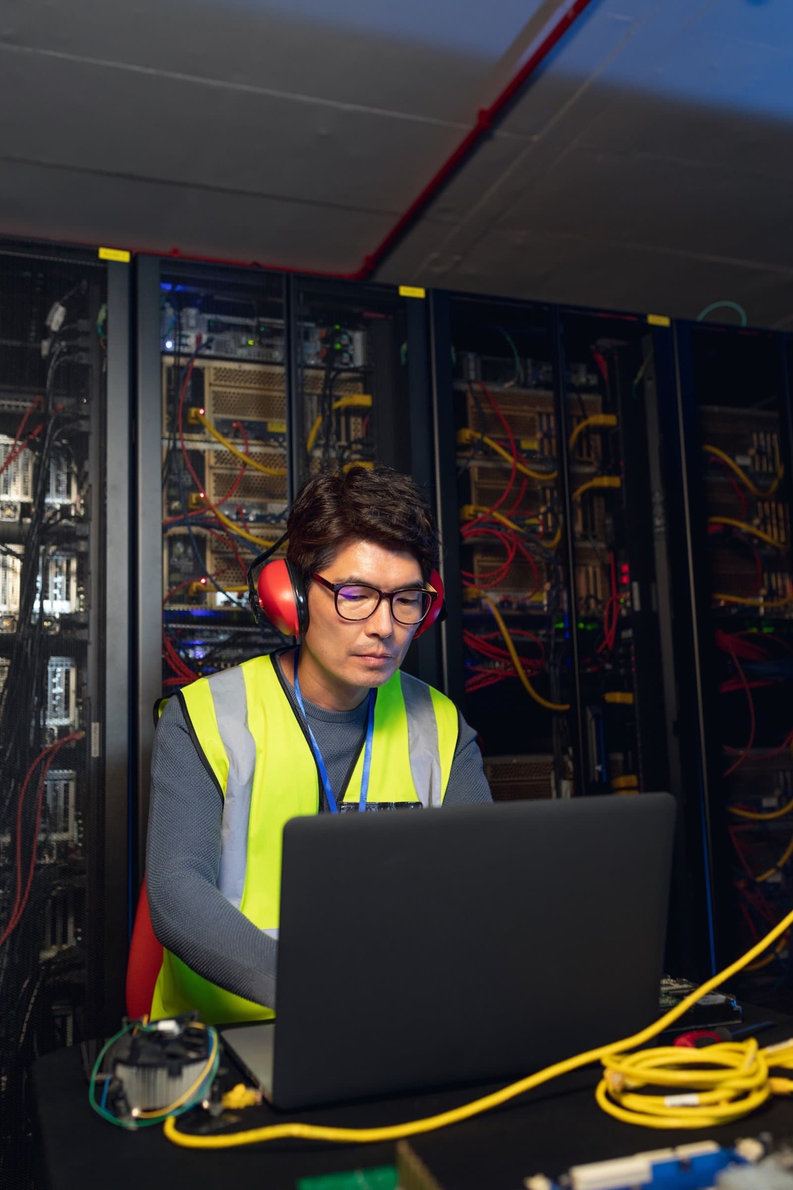 engineer-working-on-laptop-in-server-room